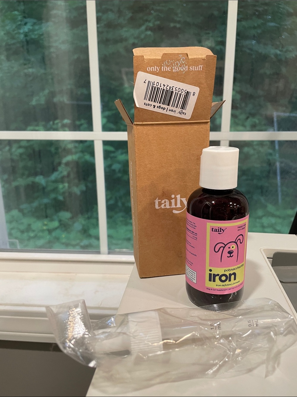 Tail iron supplement bottle in pink and yellow